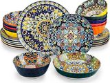multicolored plates and bowls are stacked on top of each other