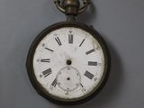 a clock that is hanging on the wall next to another clock
