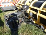 a close up of a tractor and a trailer in the grass