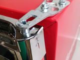 a close up of a red refrigerator with a latch on the door