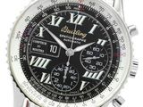 the watch is black and silver with roman numerals on the dial
