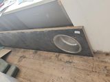 a sink in the corner of a room that is being remodeled