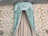 two beds in the room with a canopy over them