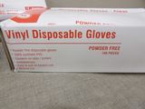 boxes of disposable gloves sitting on a table in a room