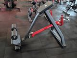 a gym with a lot of exercise equipment on the floor