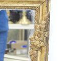 a woman taking a picture of herself in a mirror