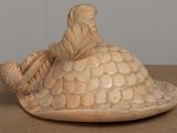 a sculpture of a turtle with a hat on it