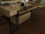 a desk with a mirror and a phone on it in a room