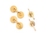 two pairs of gold cufflinks and a tie bar