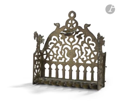 a metal shelf with a decorative design on it