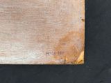 a picture of a piece of wood on a black surface