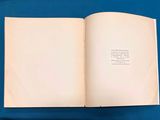 an open book on a blue surface with a blue background