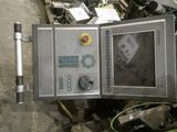 a machine that is sitting in a pile of junk