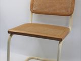 a chair that is made of wood and wicker