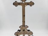 an old wooden cross on a stand with a white background