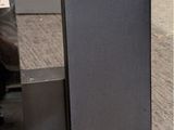two speakers that are sitting on the floor