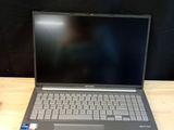 a laptop that is sitting on a wooden table