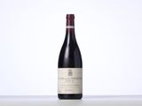 a close up of a bottle of wine on a table