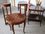 three tables and two chairs in a room