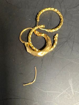 a gold ring that has been placed on a table