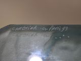 a close up of a cell phone with a blurry image of the screen