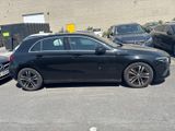a black car that is parked in a parking lot