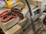 a pile of wood and a pair of scissors on a table