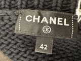 the label of a chanel sweater is displayed on the label of a chanel sweater