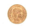 an image of a gold coin with a woman ' s head on it