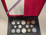 an open box of coins with a flag on it