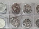 six different types of coins in a clear box