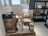 a stack of boxes sitting on a pallet in a room