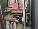 a display case with many items in it in a room