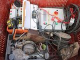 a red basket filled with assorted electrical equipment