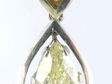 an image of a pair of earrings with a pear shaped yellow diamond
