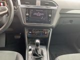 the interior of a car with a steering control and dashboard controls