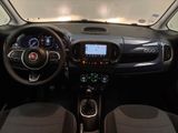 the interior of a small car with a steering wheel, dashboard, and dashboard lights