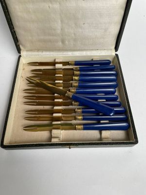 an image of a box with a bunch of pens in it