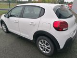 a white car that is parked in the parking lot