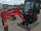 an image of a small excavator parked in a lot