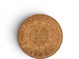 a close up of an old coin on a white surface