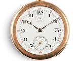 a gold pocket watch with a white face and numbers