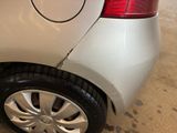 a close up of a car that has a dent in it