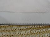 an image of a close up of a purse on a table