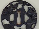 a picture of a circular iron tsubai with birds and flowers on it