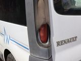 a white van that is parked on the side of the road