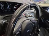 a close up of a steering wheel and dashboard of a car