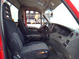 a red truck with black seats in the back of it