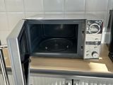 a microwave sitting on top of a counter in a kitchen