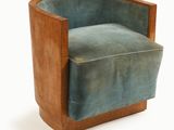 an image of a chair made of wood and blue velvet